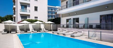 Outdoor pool, pool umbrellas, pool loungers