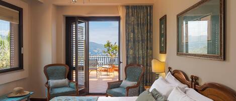 Deluxe Room, 1 Bedroom, Sea View | Minibar, in-room safe, desk, free WiFi