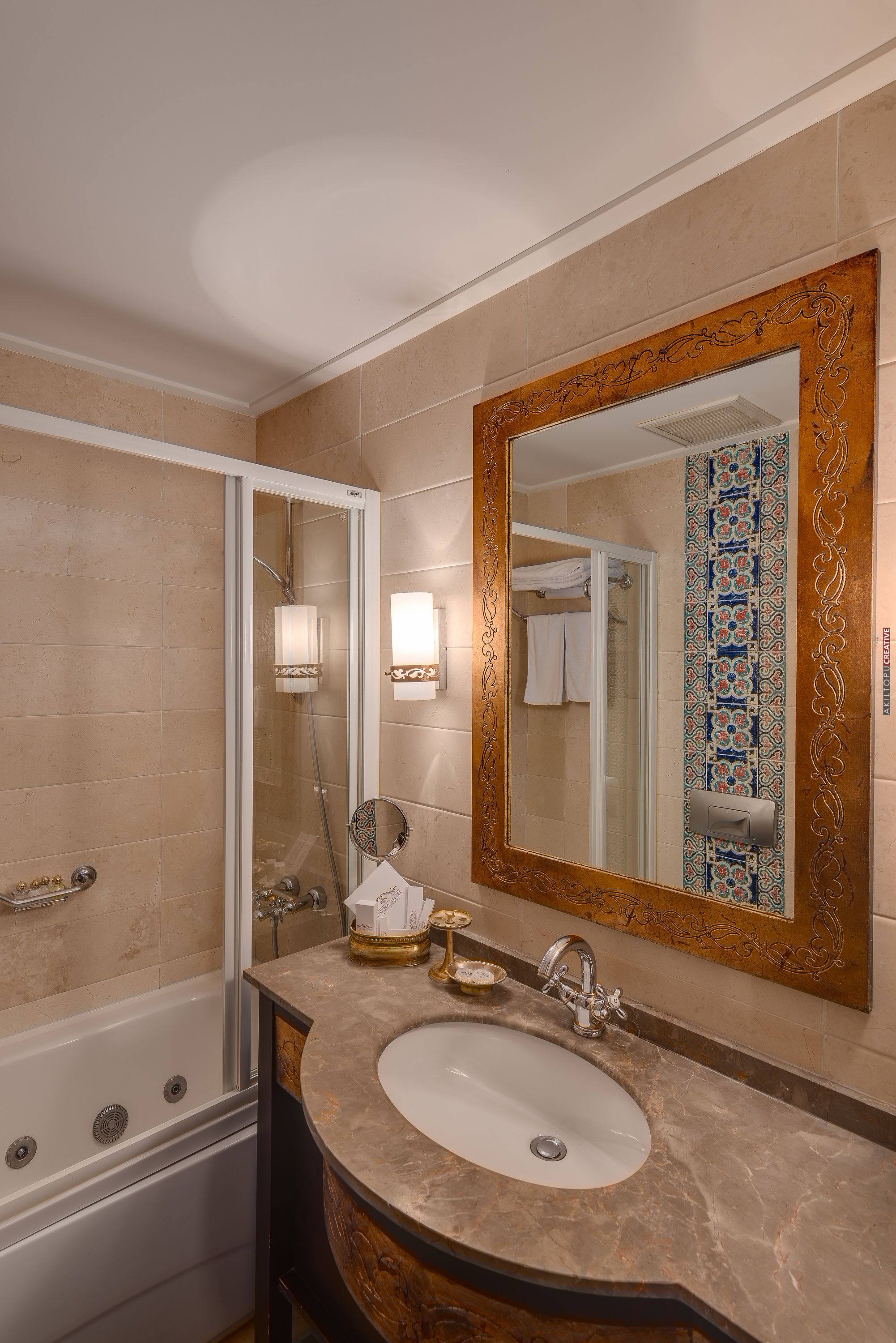 designer toiletries, hair dryer, slippers, towels