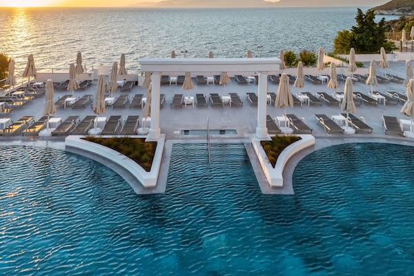 Indoor pool, outdoor pool, pool umbrellas, pool loungers