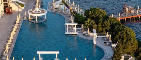 Indoor pool, outdoor pool, pool umbrellas, sun loungers