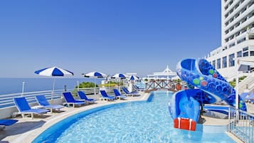 Indoor pool, outdoor pool, pool umbrellas, pool loungers