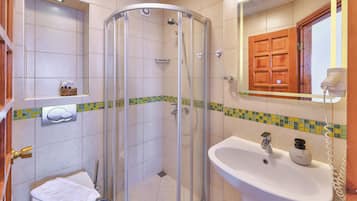 Shower, hair dryer, slippers, towels