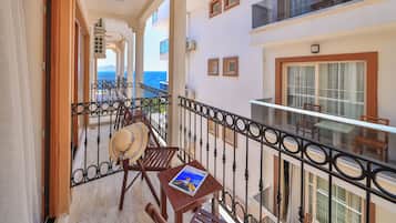 Family Suite, Multiple Beds, Partial Sea View | Minibar, desk, laptop workspace, blackout drapes