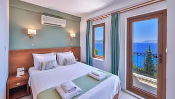 Deluxe Room, Balcony, Sea View | Minibar, desk, laptop workspace, blackout curtains