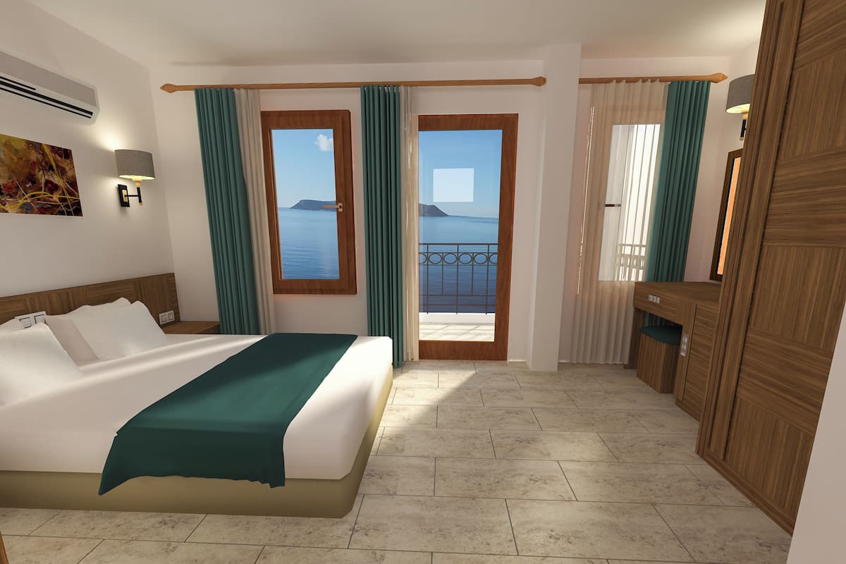 A hotel room with a bed, a desk, a view of the sea, and a balcony.