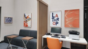 A modern office space with a desk, computer, and a chair. There are three framed artworks on the wall. - Holiday Inn Express & Suites Lathrop by IHG (Lathrop)