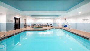 An indoor swimming pool with clear signage, including a caution about water recirculation and an emergency dial. - Holiday Inn Express & Suites Lathrop by IHG (Lathrop)