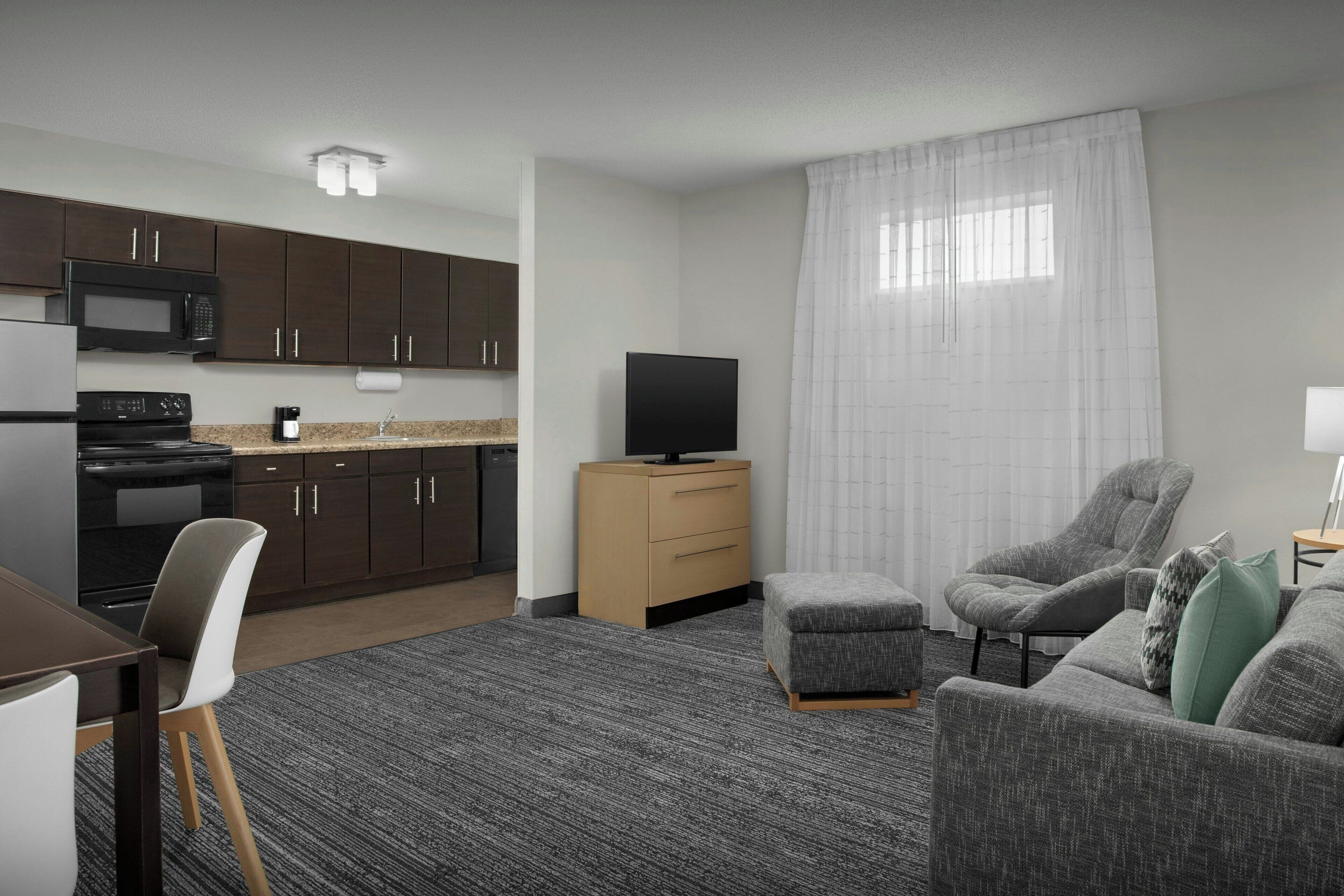 suite, 2 bedrooms | living area | 32-inch tv with cable channels, netflix, ipod dock