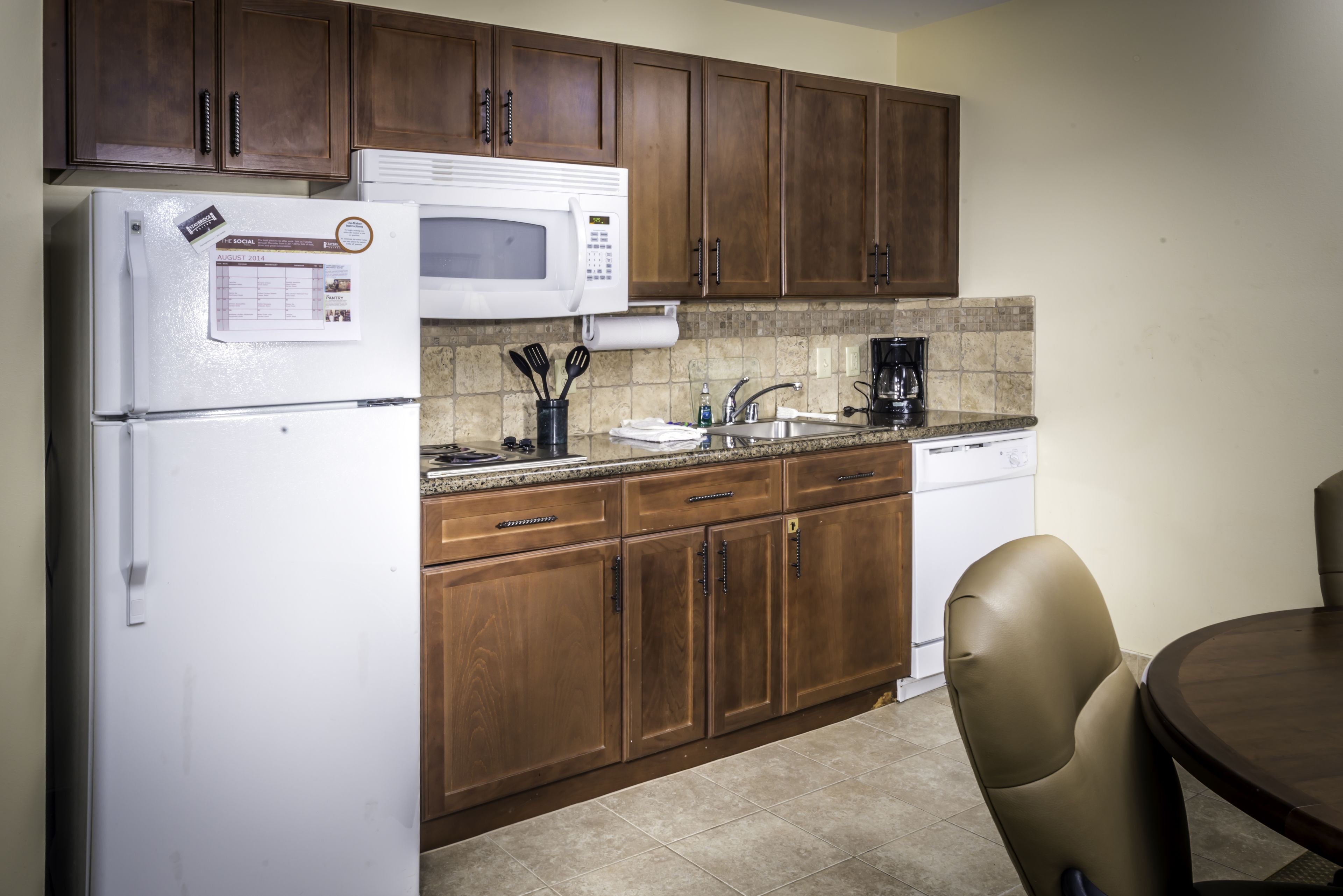 full-sized fridge, microwave, coffee/tea maker, cookware/dishes/utensils