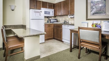 Full-size fridge, microwave, coffee/tea maker, cookware/dishes/utensils