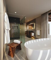 Designer toiletries, hair dryer, bathrobes, slippers