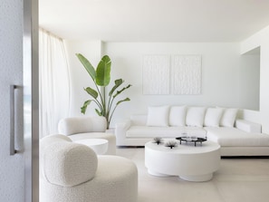 One Bedroom Grand Suite with Frontal Sea View | Living area | 50-inch LCD TV with satellite channels, TV, toys