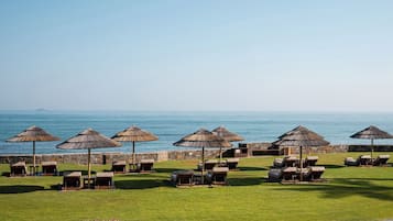On the beach, sun loungers, beach umbrellas, beach towels