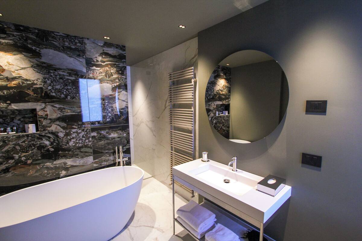suite | bathroom | separate bathtub and shower, hair dryer, bathrobes, bidet