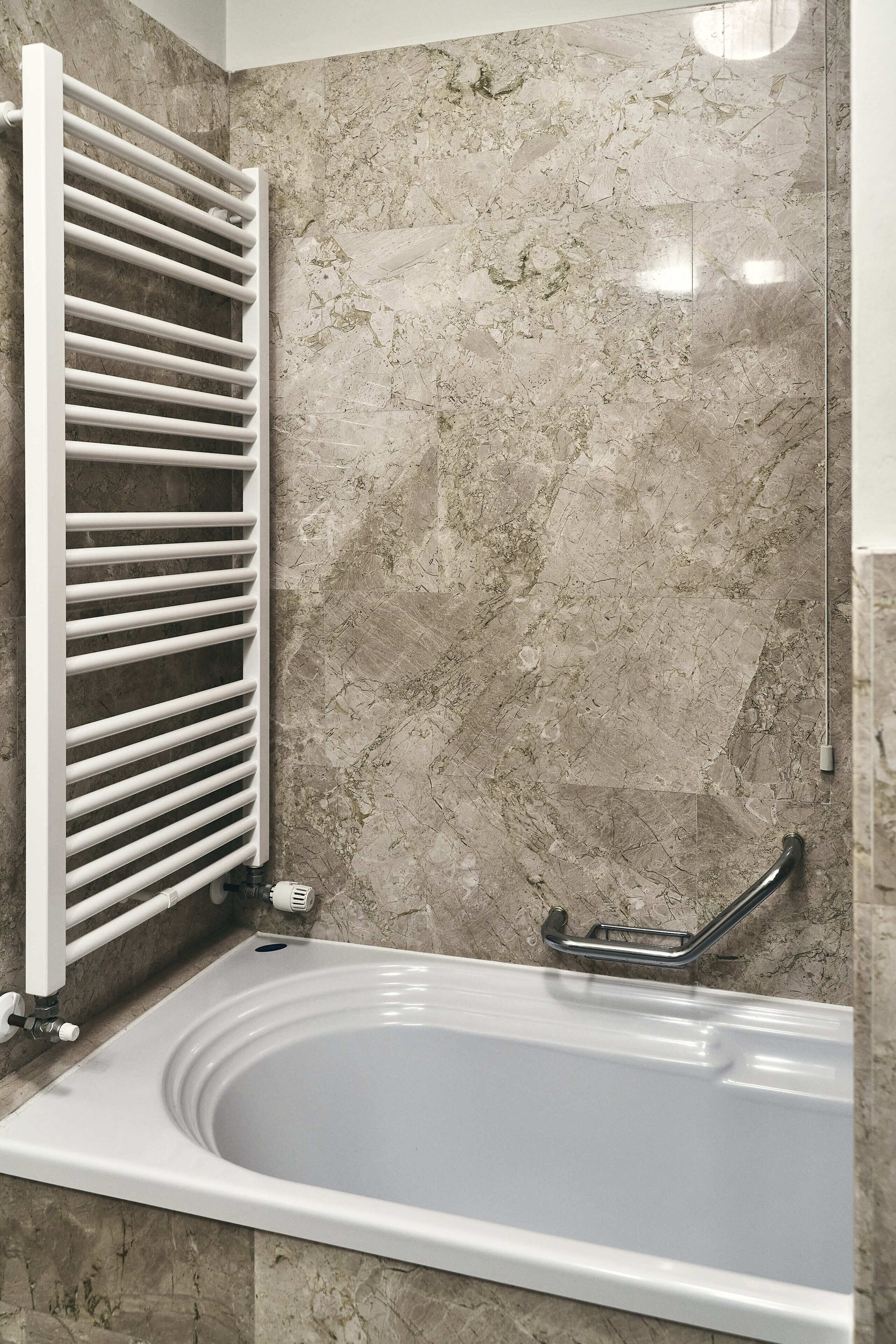 separate bathtub and shower, hair dryer, bathrobes, bidet