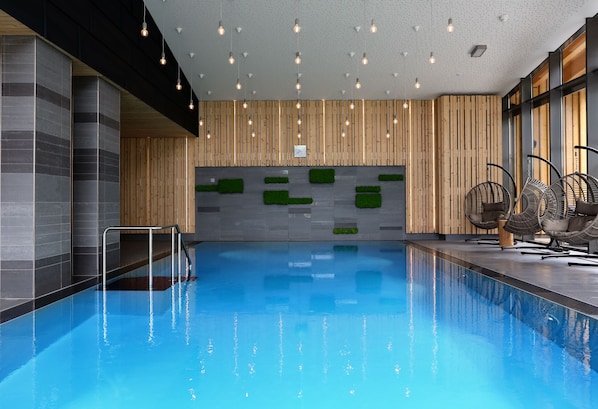 Indoor pool, open 10:30 AM to 10:00 PM, pool loungers