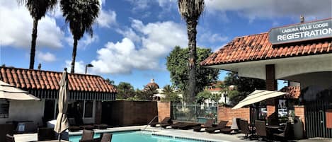 Outdoor pool, open 7:00 AM to 11:00 PM, pool umbrellas, sun loungers