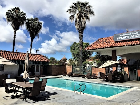 Outdoor pool, open 7:00 AM to 11:00 PM, pool umbrellas, sun loungers