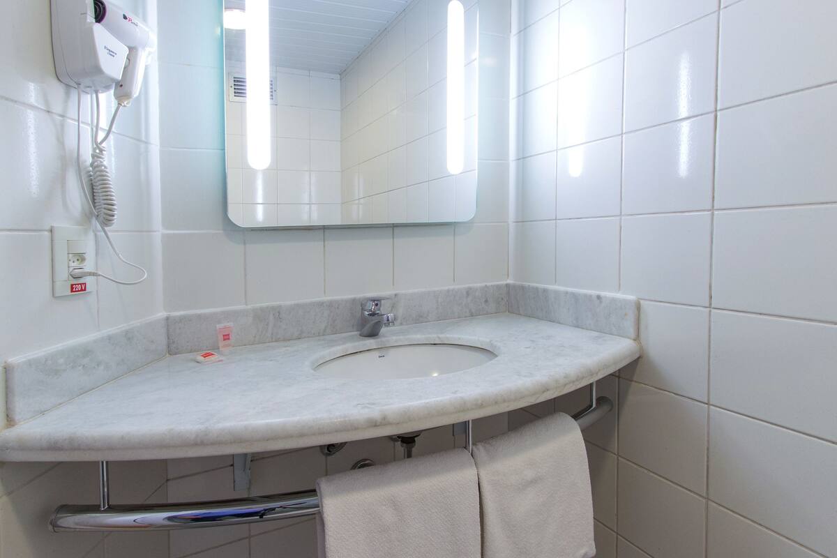 room, multiple beds (1 double and 1 single bed) | bathroom | shower, eco-friendly toiletries, towels