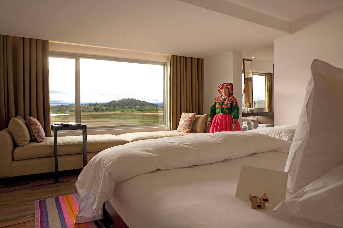 Room (Dusk) | Down comforters, minibar, in-room safe, individually decorated