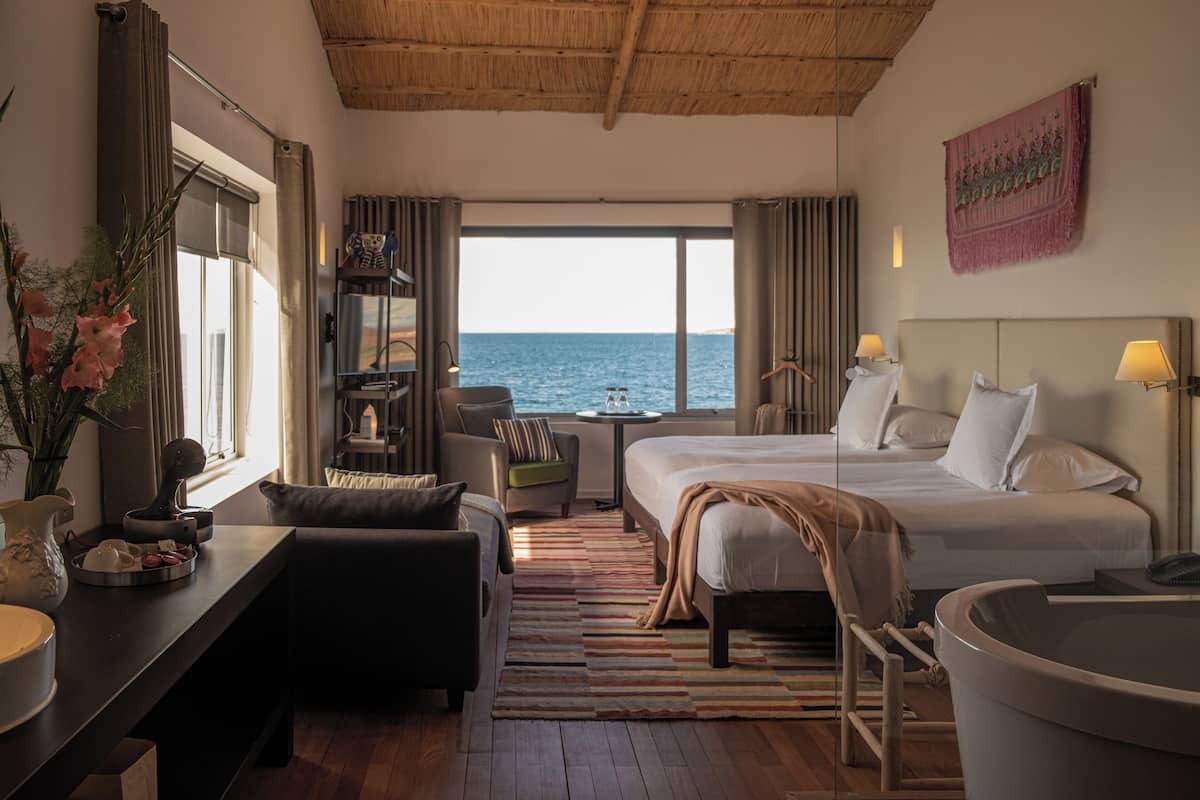 Room, Corner | Down comforters, minibar, in-room safe, individually decorated