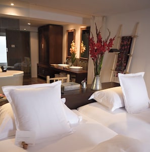 Room (Dusk) | Down comforters, minibar, in-room safe, individually decorated