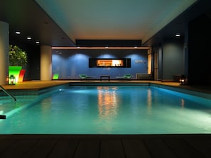 Indoor pool, open 7:00 AM to 10:00 PM, pool loungers