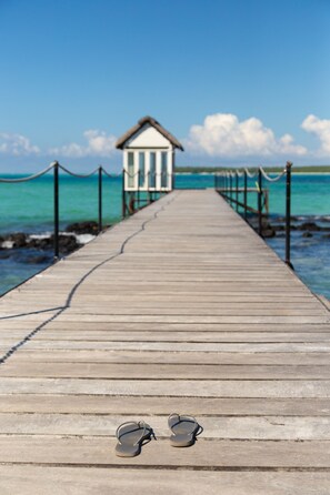 On the beach, sun loungers, snorkeling