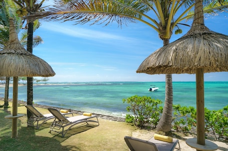 On the beach, sun loungers, snorkeling