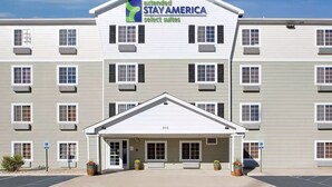 A multi-story hotel with a sign reading "extended STAY AMERICA select suites." - Extended Stay America Select Suites - Pensacola - Northwest (Pensacola)