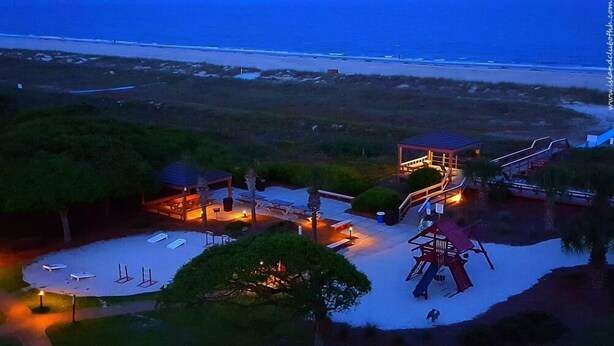 A beachside resort with a gazebo, outdoor seating, and a playground. - Seawatch at Island Club (Hilton Head Island)