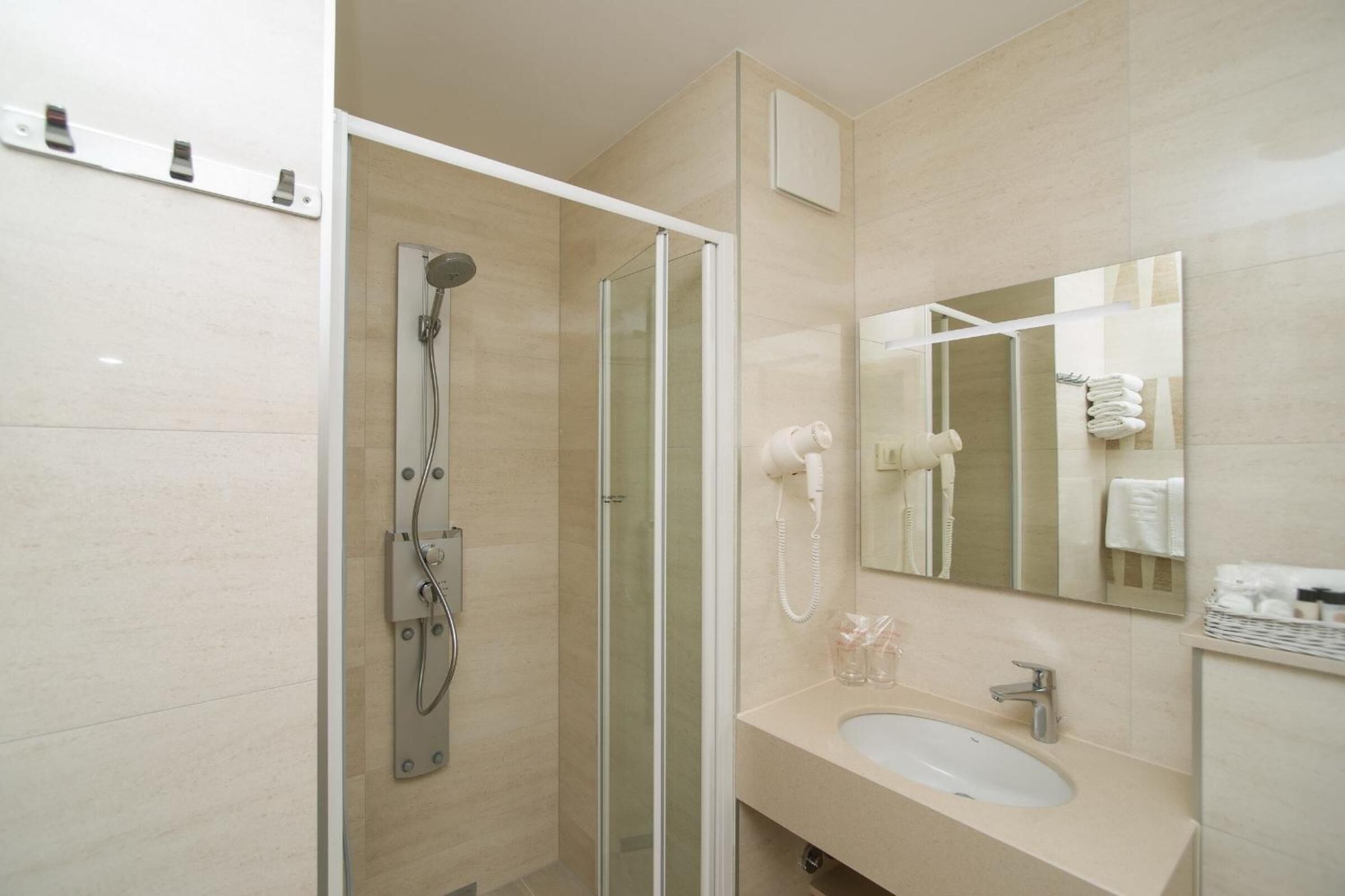 shower, free toiletries, hair dryer, towels