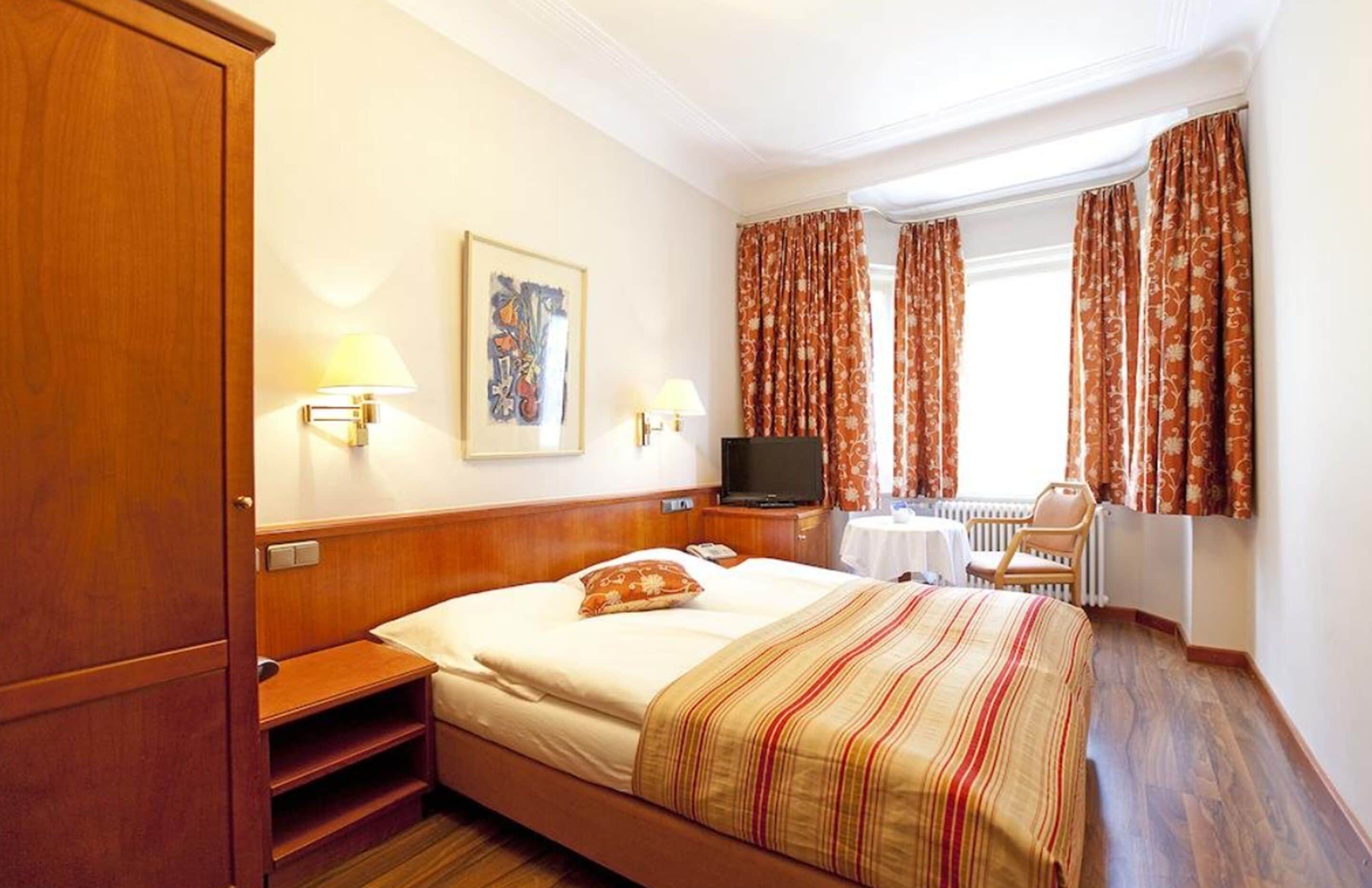 suite | frette italian sheets, premium bedding, in-room safe