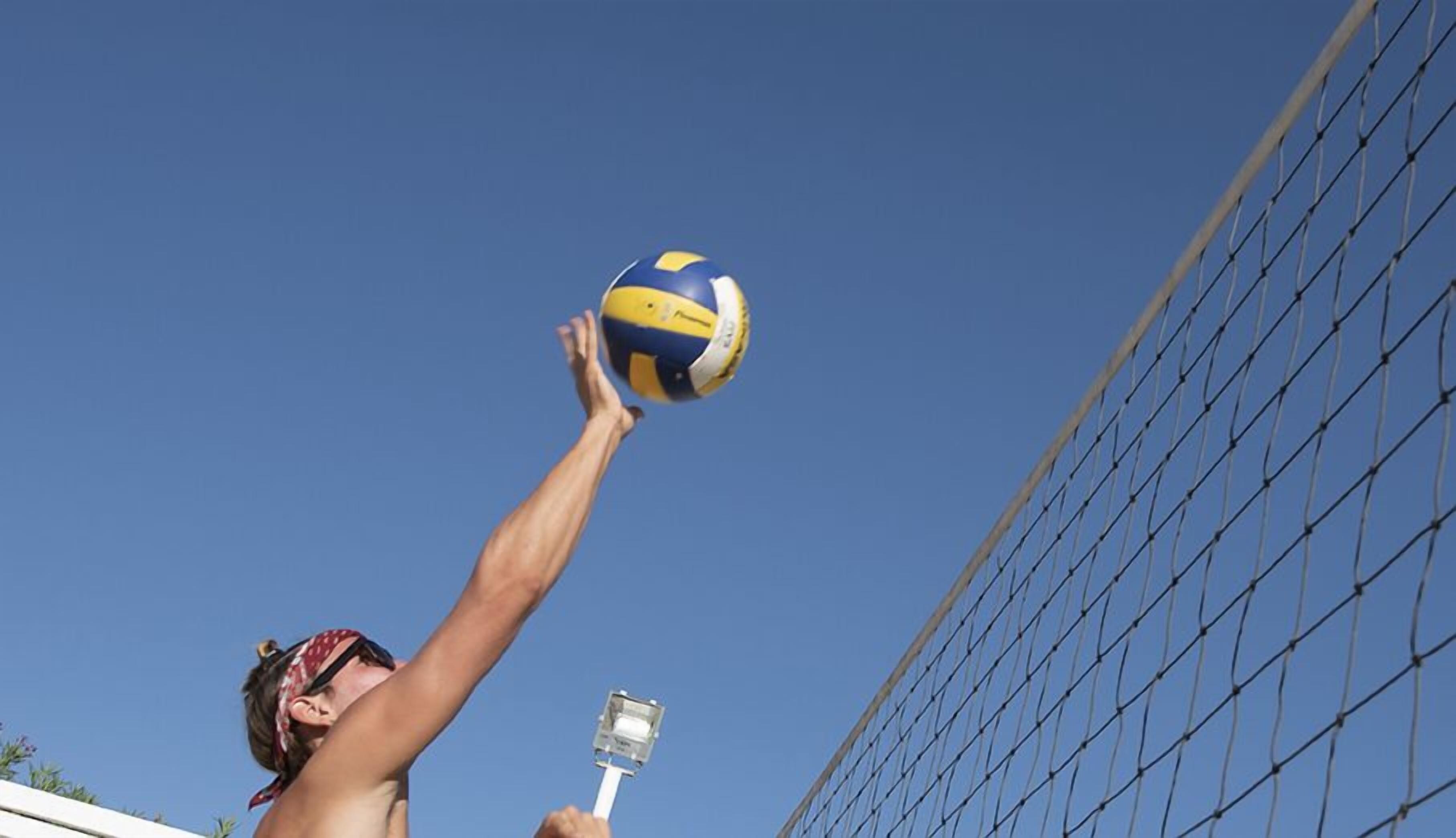 A person playing volleyball.