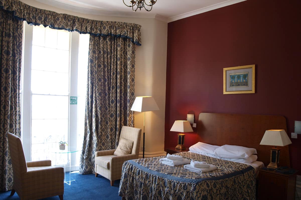 Desk, blackout curtains, iron/ironing board, bed sheets