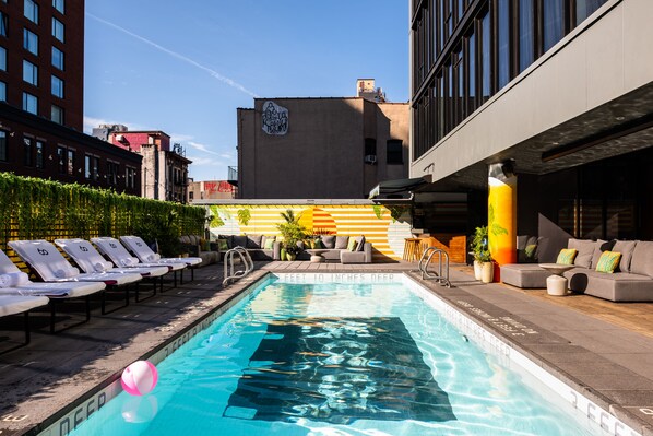 Seasonal outdoor pool, pool loungers