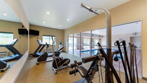 A gym with treadmills, elliptical machines, and weight equipment. - Comfort Inn Huntsville Research Park (Huntsville)
