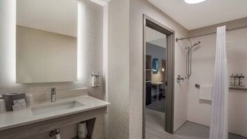 Combined shower/tub, free toiletries, hair dryer, slippers