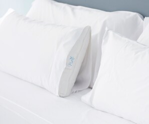 A white bed with pillows, one of which has a label that reads "Pure." - Embassy Suites by Hilton San Marcos Hotel Conference Center (San Marcos)