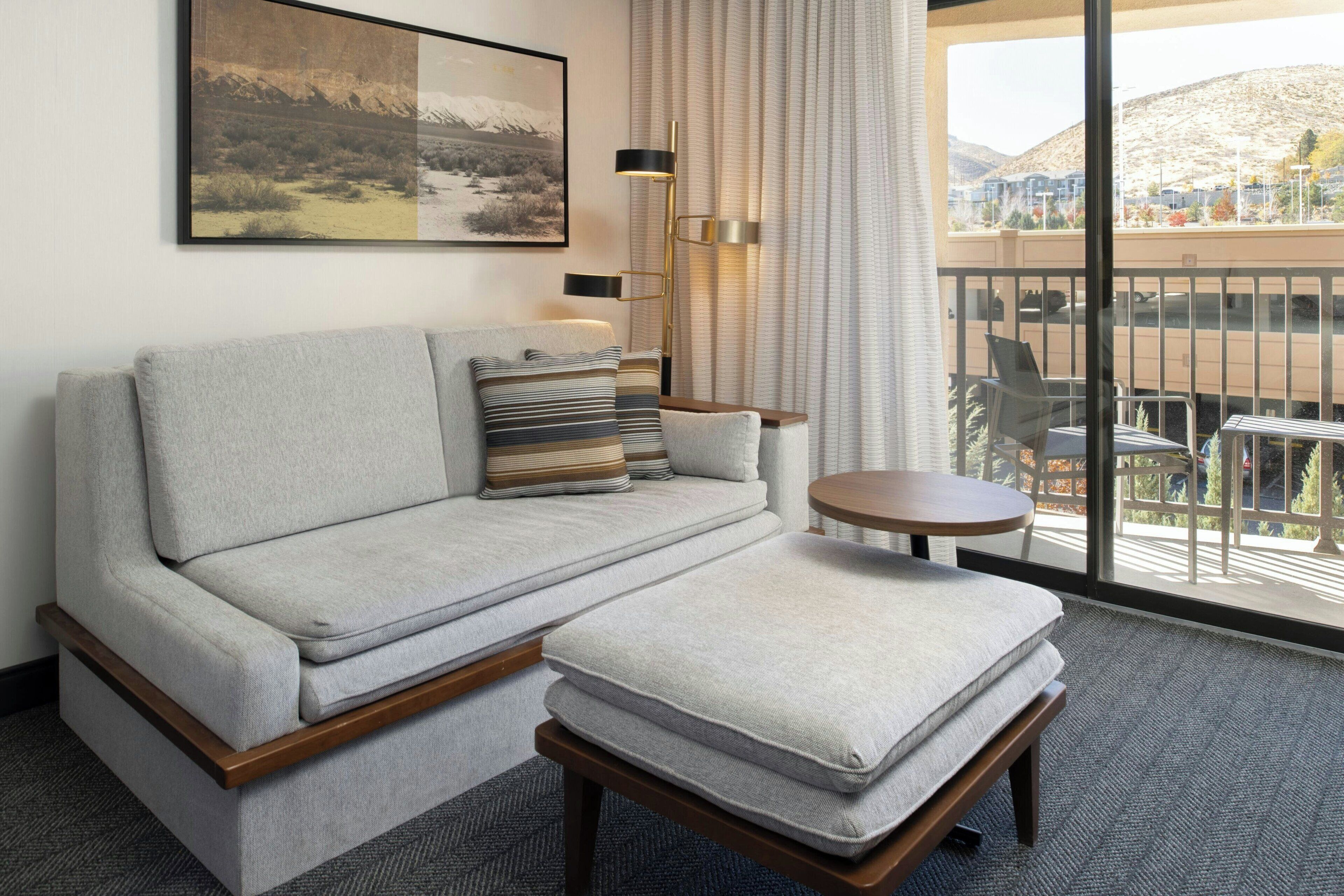 Premium bedding, desk, laptop workspace, blackout drapes