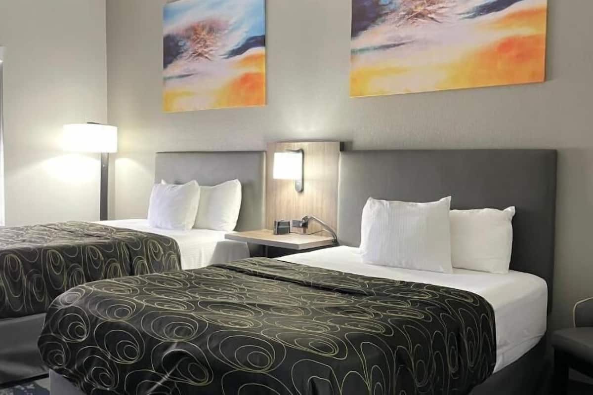 Premium bedding, desk, laptop workspace, iron/ironing board