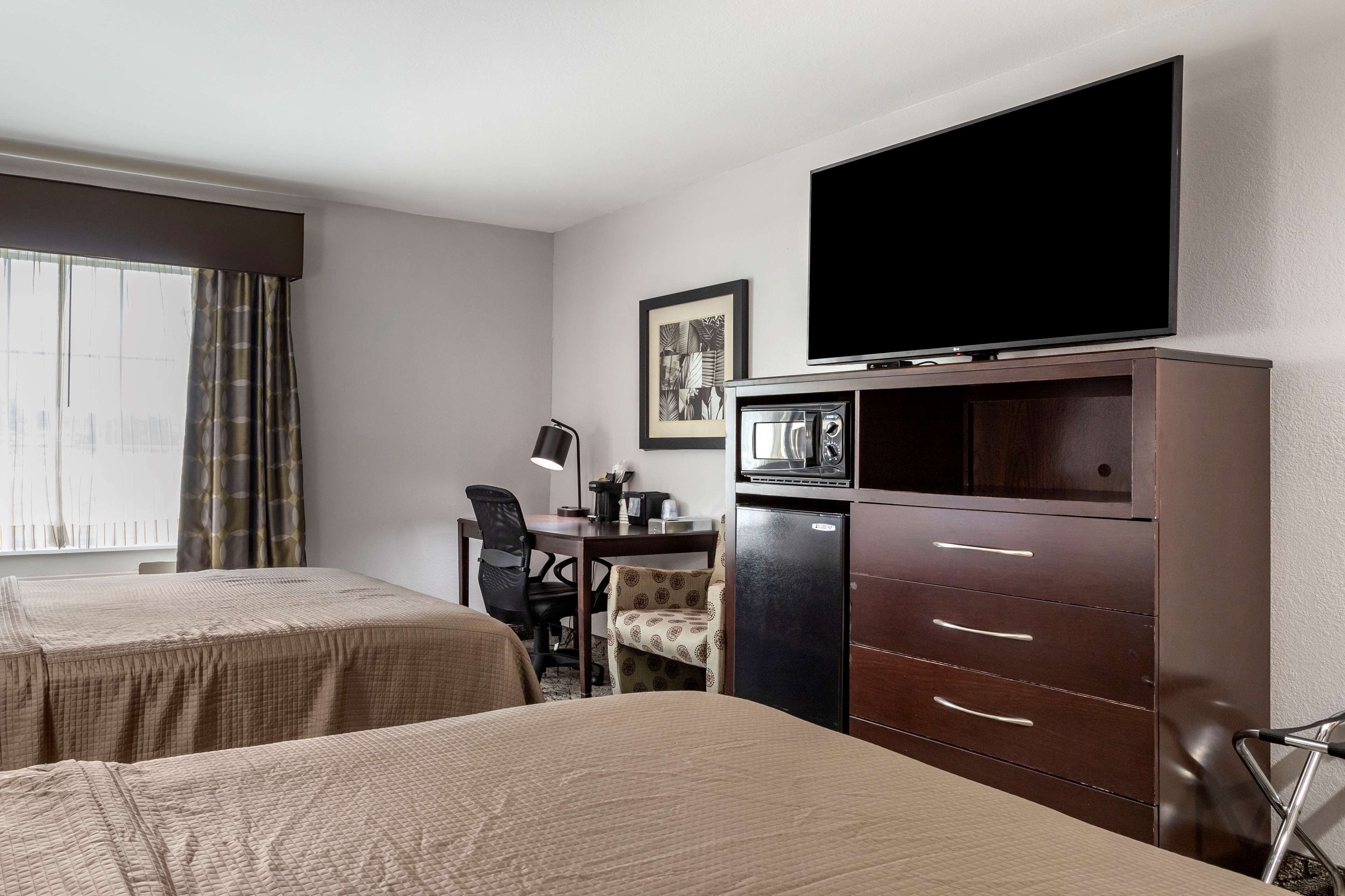 standard room, 2 queen beds, non smoking, refrigerator & microwave | desk, iron/ironing board, free wifi, bed sheets