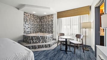 Single Room, 1 King Bed, Jetted Tub | In-room safe, desk, blackout curtains, iron/ironing board