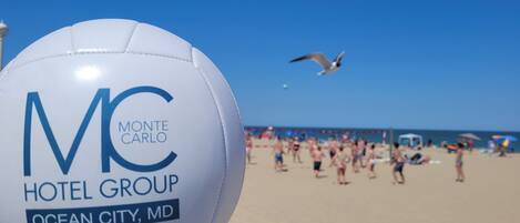A white beach ball with "Monte Carlo Hotel Group" and "Ocean City, MD" text.