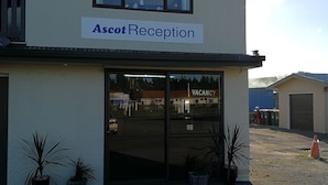 A two-story building with a sign reading "Ascot Reception" above the entrance. - Ascot Oamaru Motel (Oamaru)
