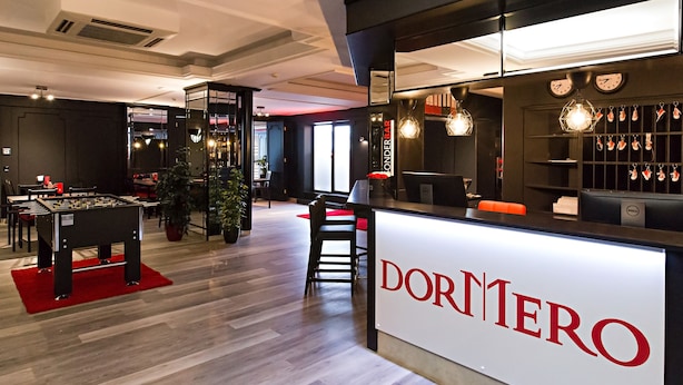 A bar area with a foosball table, a bar counter, and a sign reading "DORNER BAR".