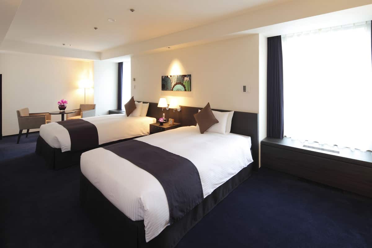 Deluxe Twin Room-Non Smoking, East Building | Down comforters, individually furnished, blackout drapes, free WiFi