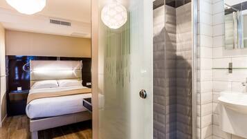Luxe beddengoed, een kluis op de kamer, een laptopwerkplek