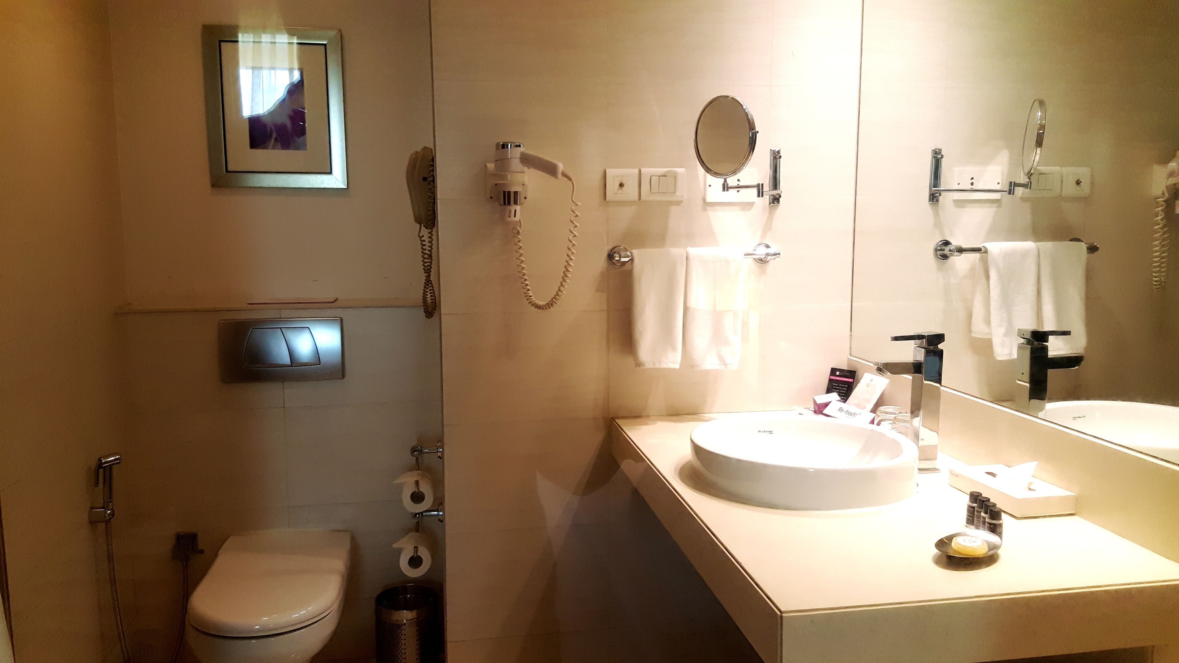 deluxe room with bathtub | bathroom | free toiletries, hair dryer, bathrobes, slippers